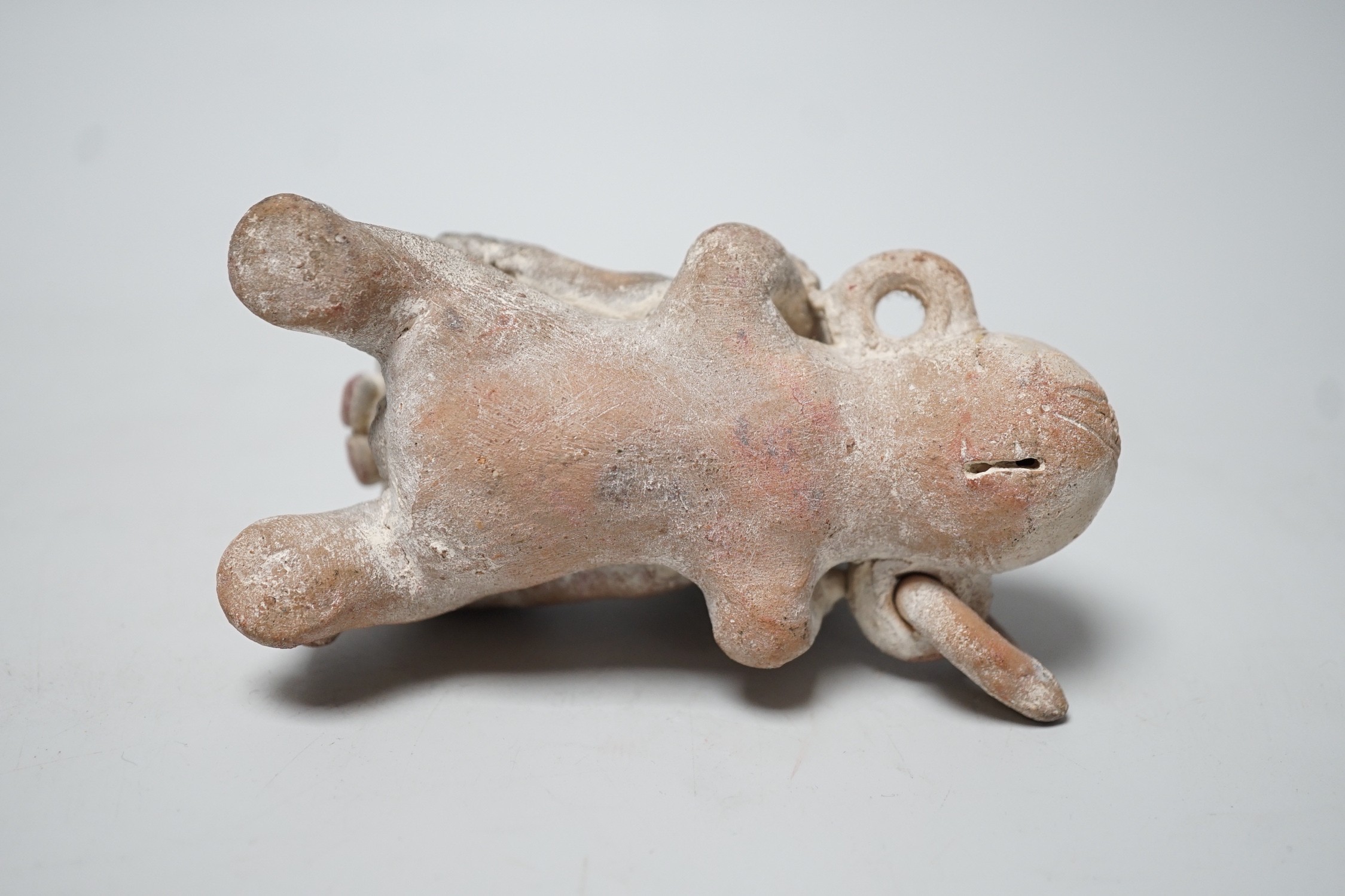 A Mayan or later biscuit earthenware erotic novelty whistle, 12cm long